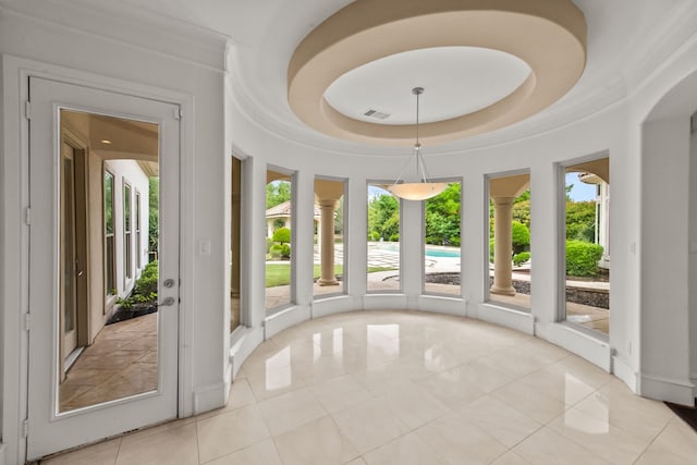 unfurnished sunroom featuring visible vents