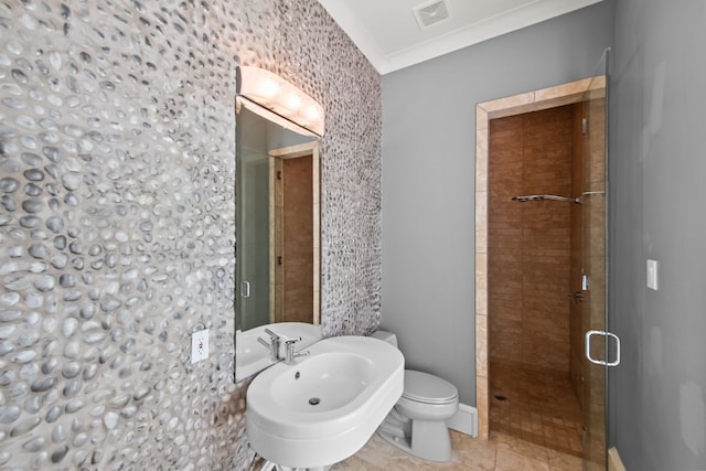 bathroom with toilet, visible vents, a shower stall, and a sink