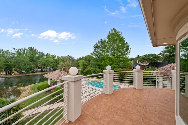 exterior space featuring a water view and a balcony