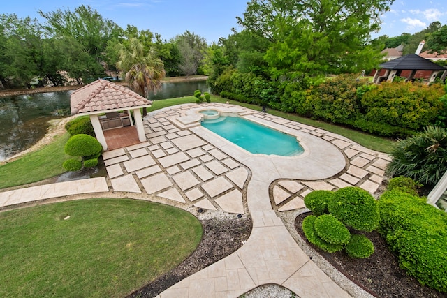 outdoor pool with an in ground hot tub, a patio, a gazebo, and a water view