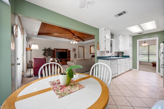 dining room with light tile patterned floors, wood ceiling, ceiling fan, and visible vents