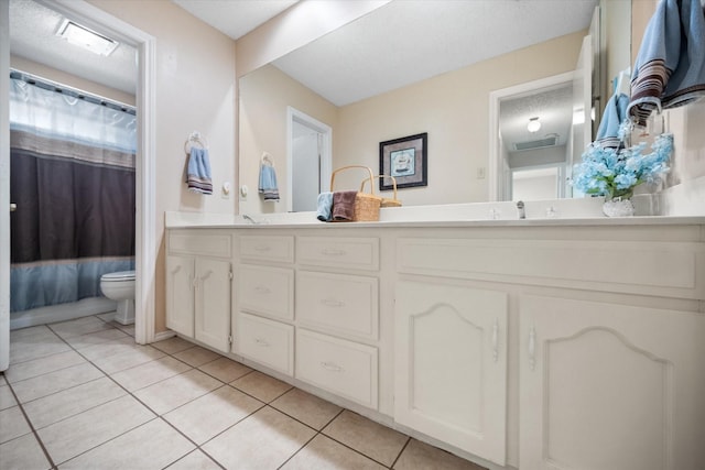 full bathroom with a sink, toilet, visible vents, double vanity, and tile patterned flooring