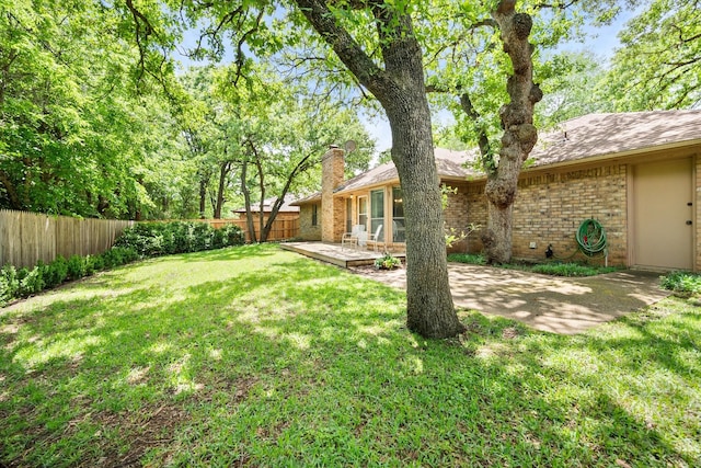 view of yard with a patio and a fenced backyard