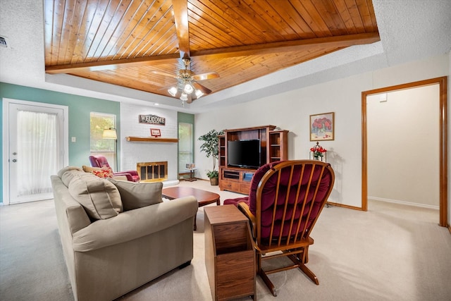 living room featuring carpet, a raised ceiling, baseboards, and wooden ceiling