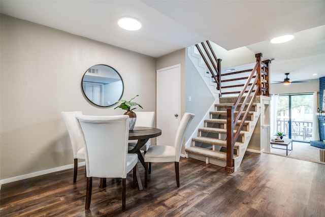 dining space with stairs, a ceiling fan, baseboards, and wood finished floors