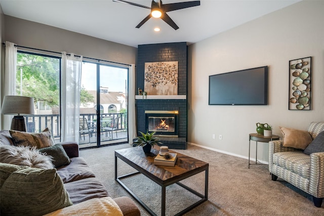 living room featuring a ceiling fan, a brick fireplace, carpet floors, baseboards, and recessed lighting