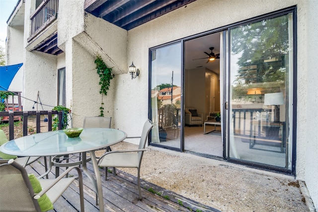 exterior space with outdoor dining area and a balcony