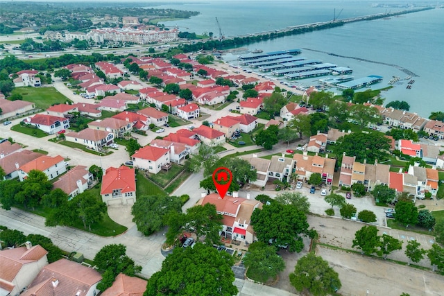 bird's eye view featuring a water view and a residential view