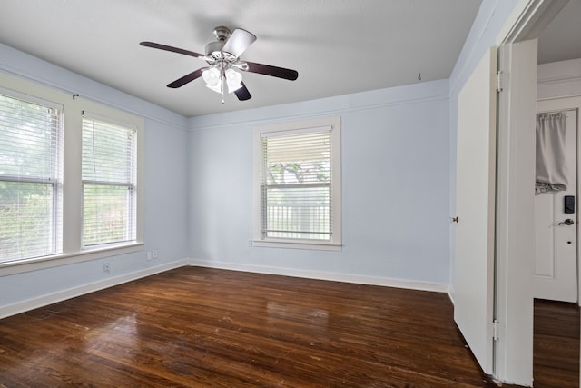 unfurnished room with ceiling fan, baseboards, wood finished floors, and a healthy amount of sunlight
