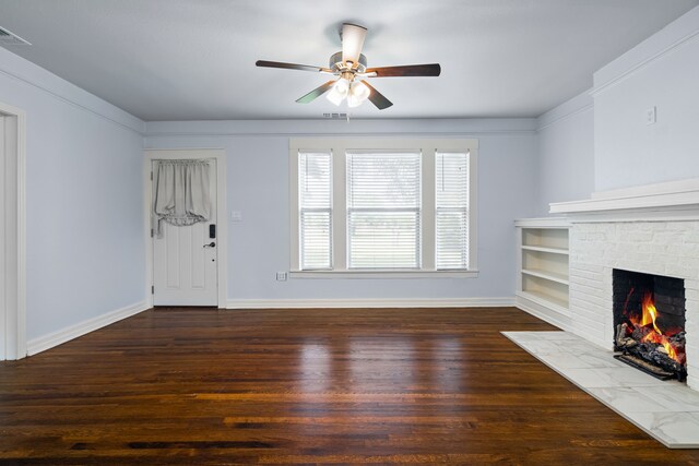 unfurnished living room featuring ceiling fan, visible vents, baseboards, a fireplace, and wood finished floors