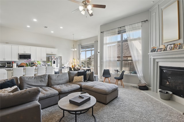1164 Red Hawk Ln, Forney, TX 75126 - living room with a fireplace with flush hearth, visible vents, baseboards, recessed lighting, and a ceiling fan