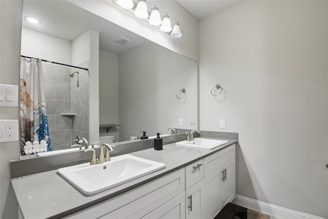 1164 Red Hawk Ln, Forney, TX 75126 - bathroom with curtained shower, double vanity, a sink, and baseboards