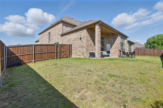 1164 Red Hawk Ln, Forney, TX 75126 - back of property with a lawn, a fenced backyard, and brick siding
