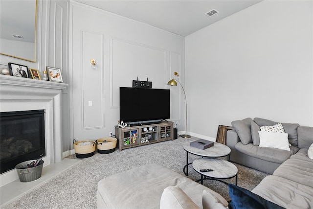 1164 Red Hawk Ln, Forney, TX 75126 - living room featuring carpet flooring, visible vents, and a glass covered fireplace