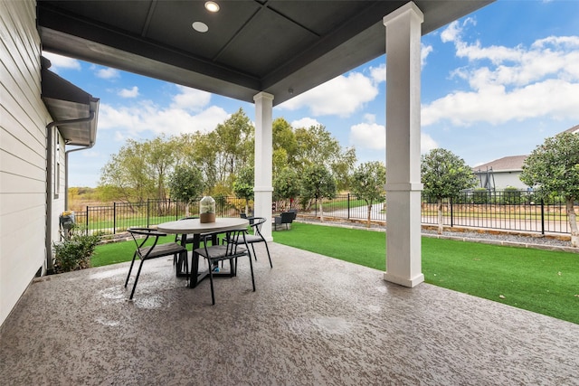 view of patio with outdoor dining space and a fenced backyard