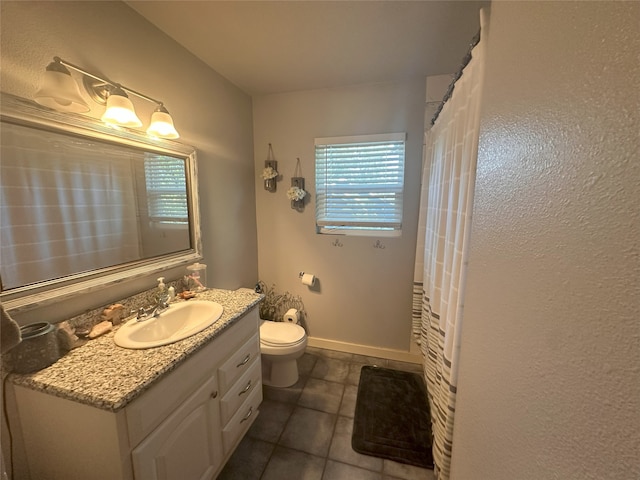 full bath featuring tile patterned floors, vanity, toilet, and plenty of natural light