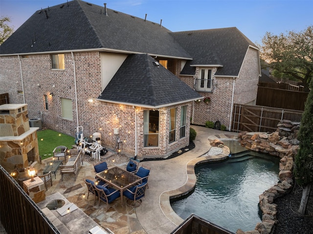 view of pool featuring a fenced backyard, grilling area, a fenced in pool, and a patio area