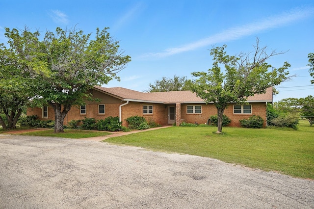 2134 Braune Rd, Abilene, TX 79606 - ranch-style home featuring brick siding and a front yard