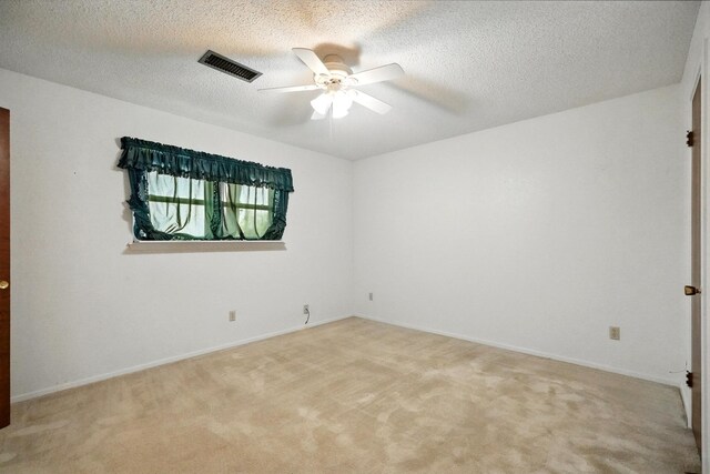 2134 Braune Rd, Abilene, TX 79606 - unfurnished room with ceiling fan, light colored carpet, baseboards, and a textured ceiling