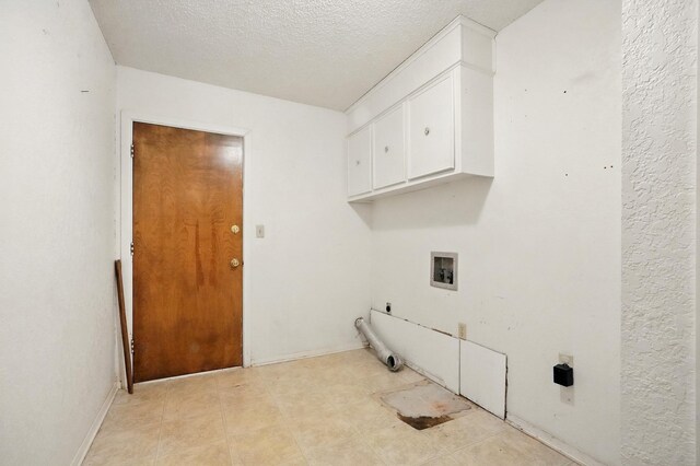 2134 Braune Rd, Abilene, TX 79606 - washroom with cabinet space, hookup for a washing machine, and a textured ceiling