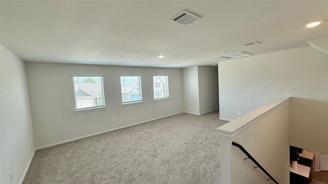 13124 N Haven Way, Providence Village, TX 76227 - carpeted empty room featuring baseboards, a textured ceiling, and recessed lighting