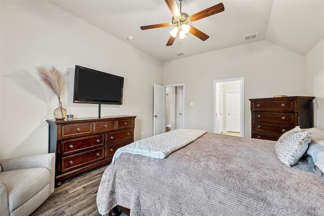 bedroom featuring visible vents, lofted ceiling, wood finished floors, and ceiling fan