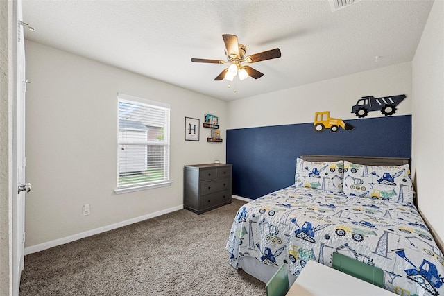 carpeted bedroom featuring baseboards and ceiling fan