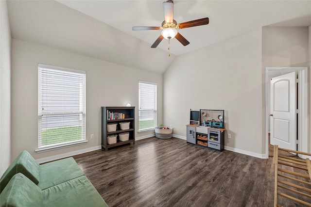 interior space featuring baseboards, ceiling fan, lofted ceiling, and dark wood-style floors