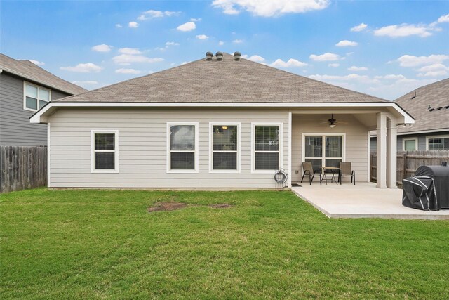 back of property featuring a patio, a fenced backyard, a ceiling fan, and a lawn