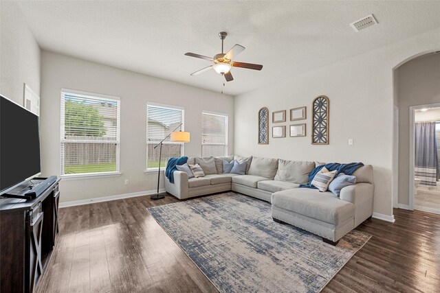 3017 Gilchrist Dr, Waco, TX 76655 - living room with ceiling fan, visible vents, wood finished floors, and arched walkways