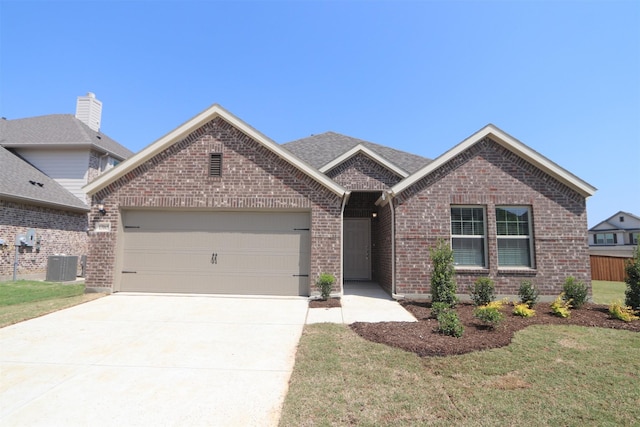 ranch-style house with concrete driveway, central air condition unit, a front yard, an attached garage, and brick siding