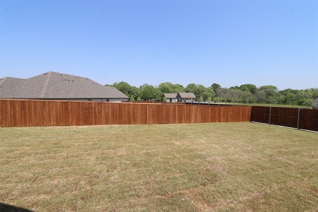 view of yard featuring a fenced backyard