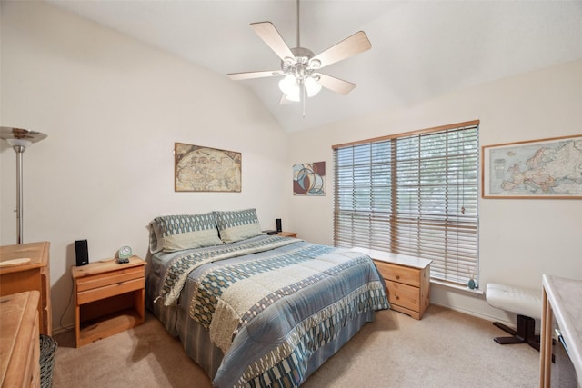 bedroom featuring lofted ceiling, a ceiling fan, and light carpet