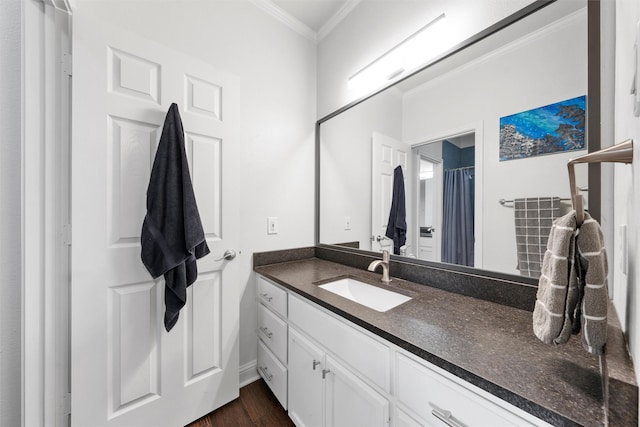 full bath featuring crown molding, wood finished floors, and vanity