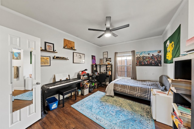 bedroom featuring dark wood-style flooring, ceiling fan, and ornamental molding