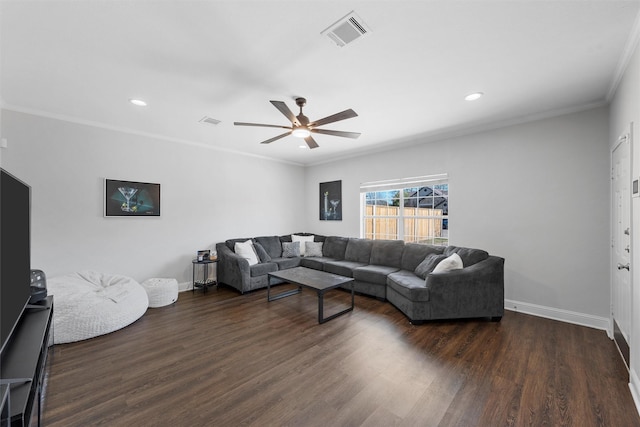 living room featuring dark wood-style floors, visible vents, crown molding, and baseboards