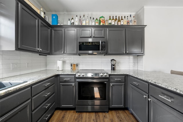 kitchen with stainless steel appliances, dark wood-style flooring, crown molding, and light stone counters