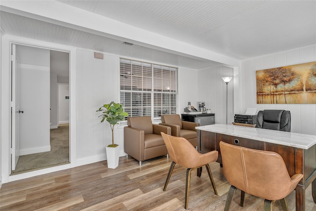 interior space with baseboards and wood finished floors