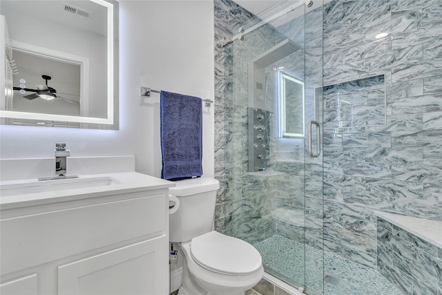 bathroom featuring ceiling fan, visible vents, a stall shower, toilet, and vanity