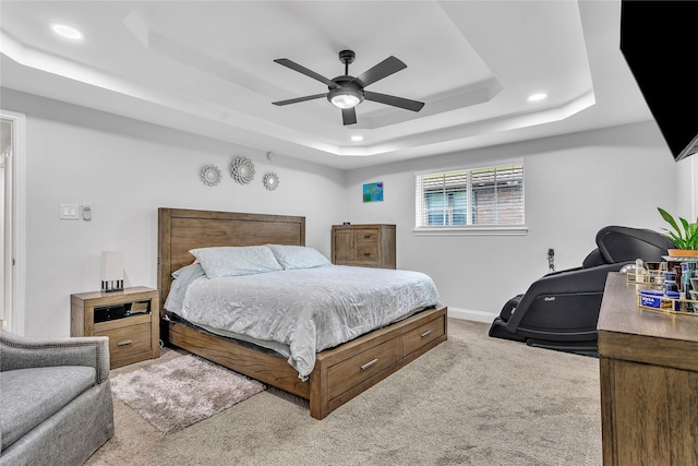 carpeted bedroom with baseboards, recessed lighting, a ceiling fan, and a tray ceiling