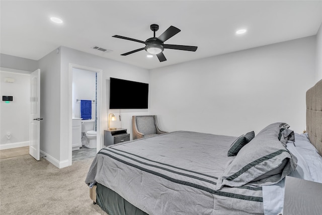 carpeted bedroom with visible vents, ceiling fan, baseboards, recessed lighting, and ensuite bath