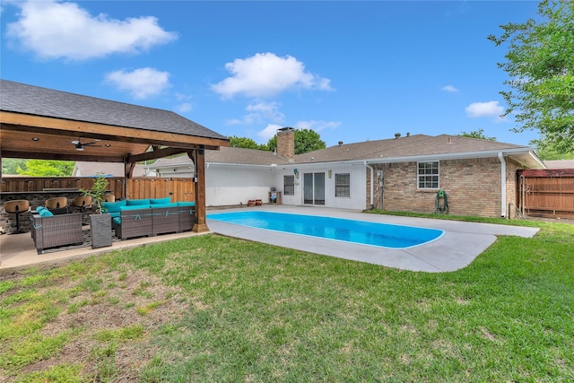 view of pool with a fenced in pool, a yard, outdoor lounge area, and a fenced backyard