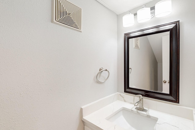 bathroom featuring visible vents and vanity