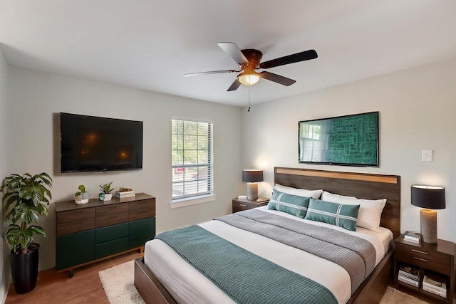 bedroom featuring a ceiling fan and wood finished floors