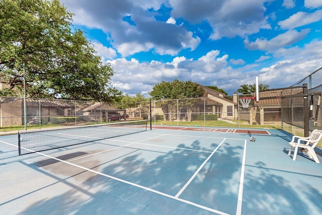 view of sport court with community basketball court and fence