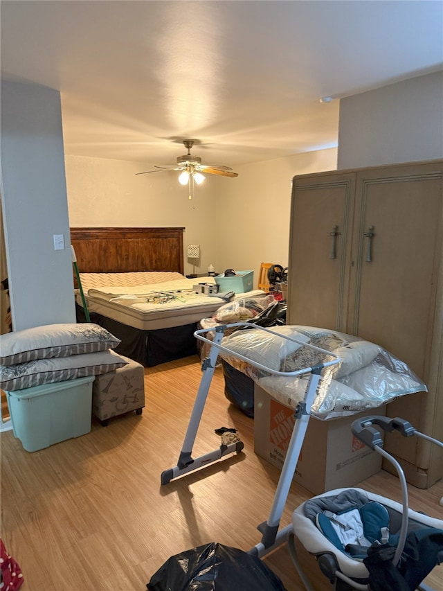 bedroom featuring wood finished floors and a ceiling fan