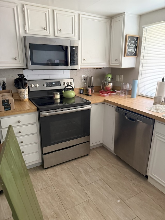 kitchen featuring white cabinets and stainless steel appliances