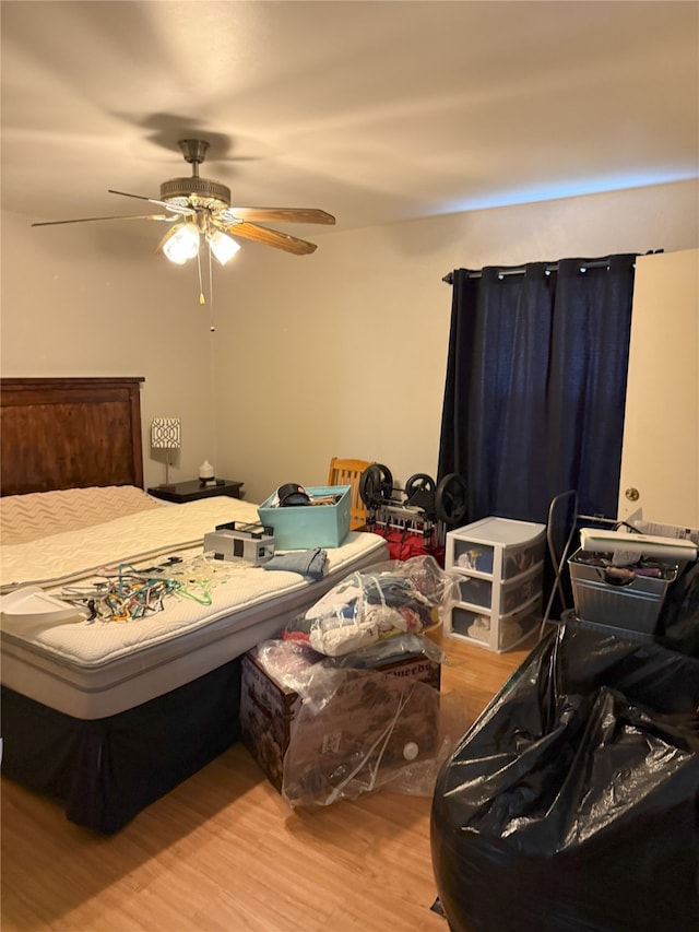 bedroom with wood finished floors and ceiling fan
