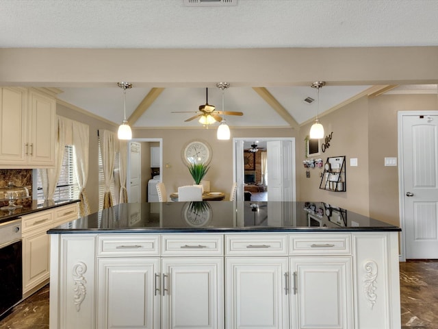 kitchen featuring a kitchen island, a ceiling fan, dark countertops, and vaulted ceiling with beams