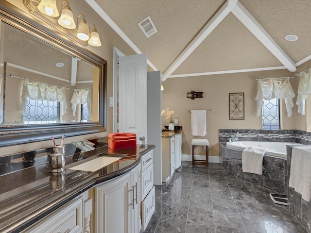 full bathroom with visible vents, a bath, a healthy amount of sunlight, and vanity